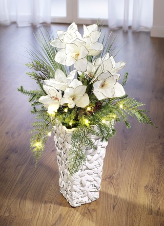 Beleuchtetes Amaryllis-Gesteck in Vase