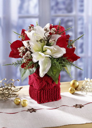 Gesteck mit roten und weissen Poinsettia-Blüten