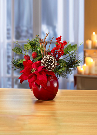 Poinsettia-Gesteck in Apfeltopf