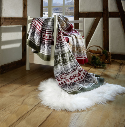 Kuschelige Wohndecke mit winterlichen Motiven