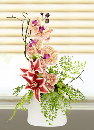 Bezauberndes Orchideen-Gesteck in Vase 