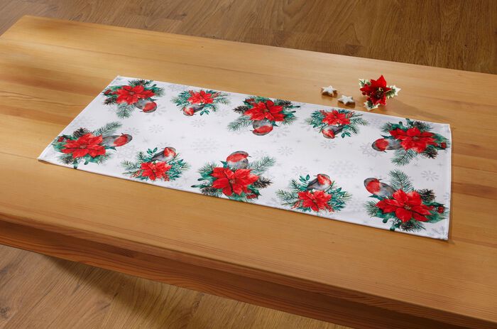 Tisch- und Raumdekoration mit niedlichen Rotkehlchen 